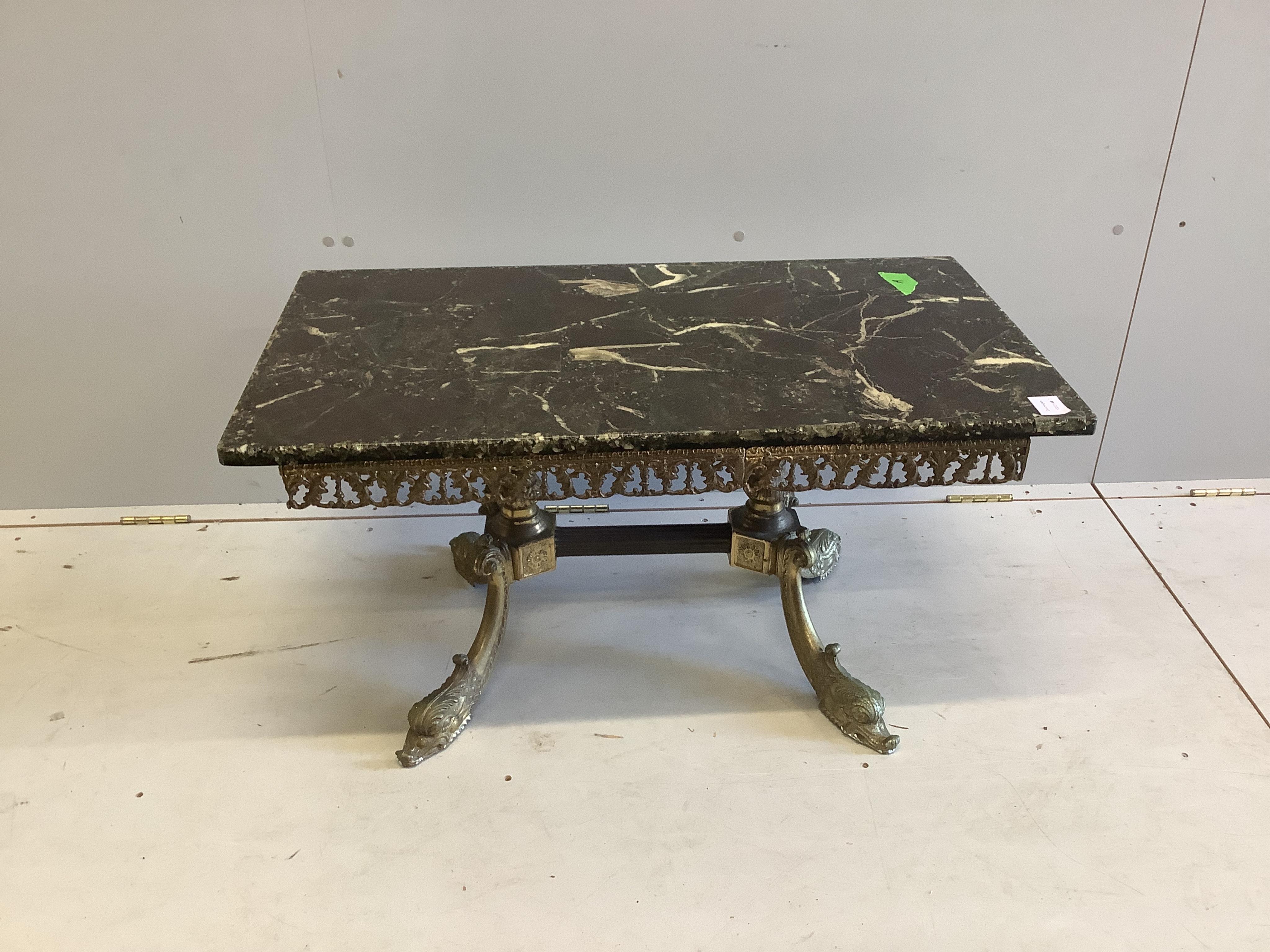 A rectangular faux marble and gilt metal rectangular coffee table on scroll dolphin feet, width 89cm, depth 50cm, height 46cm. Condition - good